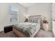 Bright bedroom with a comfortable bed, a window providing natural light, and stylish decor at 188 Olympus Way, Kissimmee, FL 34759