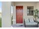 Inviting front porch with comfortable seating and a welcoming entrance at 188 Olympus Way, Kissimmee, FL 34759