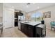Contemporary kitchen with a large center island, stainless steel appliances, and ample storage at 188 Olympus Way, Kissimmee, FL 34759