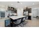 Spacious kitchen with a large island, stylish cabinets, and stainless steel appliances at 188 Olympus Way, Kissimmee, FL 34759
