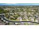 Bird's eye view of the neighborhood featuring houses and green landscaping beneath a partly cloudy blue sky in a Gathering-friendly area at 2015 Sandy Garden Ln, Winter Garden, FL 34787