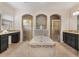 Luxurious bathroom with a soaking tub, dual vanities, and tiled walk-in showers at 2015 Sandy Garden Ln, Winter Garden, FL 34787