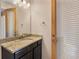 The bathroom has granite counters, wood cabinets, brushed nickel fixtures and direct access to the outdoor via a glass-enclosed door at 2015 Sandy Garden Ln, Winter Garden, FL 34787