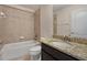 Standard bathroom with a bathtub, shower, and vanity with a granite countertop at 2015 Sandy Garden Ln, Winter Garden, FL 34787