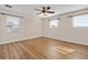 Bright bedroom with laminate floors, ceiling fan, and ample natural light at 2015 Sandy Garden Ln, Winter Garden, FL 34787