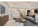 Stylish living room showcasing modern decor, high ceilings, and an open staircase at 2015 Sandy Garden Ln, Winter Garden, FL 34787