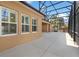 Outdoor patio with screened enclosure that offers protection from insects and sun at 2015 Sandy Garden Ln, Winter Garden, FL 34787