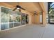Large screened patio with ceiling fans and sliding glass doors for indoor-outdoor living at 2015 Sandy Garden Ln, Winter Garden, FL 34787