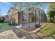 Lovely view of the house's screened-in patio, featuring a spacious area for relaxing and enjoying the outdoors in comfort at 2015 Sandy Garden Ln, Winter Garden, FL 34787