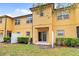 View of townhome backyard featuring green space and sliding glass door entry at 2040 Retreat View Cir, Sanford, FL 32771