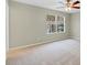 Neutral bedroom with large window showing trees at 2040 Retreat View Cir, Sanford, FL 32771