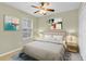 Comfortable bedroom with a ceiling fan, window, and neutral colors, creating a cozy and inviting space at 2040 Retreat View Cir, Sanford, FL 32771