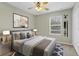 Cozy bedroom with ceiling fan, large window, and art at 2040 Retreat View Cir, Sanford, FL 32771