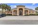 Elegant clubhouse featuring a neutral color scheme, arched entryway, and well-manicured landscaping at 2040 Retreat View Cir, Sanford, FL 32771