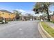 Community entrance gate with brick pillars and wrought iron fencing, enhancing security and curb appeal at 2040 Retreat View Cir, Sanford, FL 32771