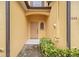 Front door with brick walkway and garden space for a townhome at 2040 Retreat View Cir, Sanford, FL 32771