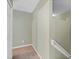 Hallway with carpeting, neutral walls, and a staircase with handrails, creating a smooth transition between levels at 2040 Retreat View Cir, Sanford, FL 32771
