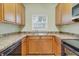 Galley kitchen featuring tile backsplash and stainless steel faucet and sink at 2040 Retreat View Cir, Sanford, FL 32771