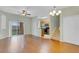 Living area with open floor plan, hardwood floors, and sliding glass doors at 2040 Retreat View Cir, Sanford, FL 32771