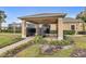 Conveniently located community mailboxes under a covered area with beautiful landscaping at 2040 Retreat View Cir, Sanford, FL 32771