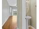 Powder room with a pedestal sink, decorative mirror, and neutral color palette at 2040 Retreat View Cir, Sanford, FL 32771