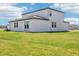 Expansive back yard with lush grass and a modern home design creating an inviting outdoor space at 2097 Rosewood Dr, Bartow, FL 33830