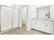Modern bathroom with double vanity, granite counters, and a glass-enclosed shower exuding luxury at 2097 Rosewood Dr, Bartow, FL 33830
