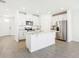 Modern kitchen with stainless steel appliances, granite countertops, and a functional island at 2097 Rosewood Dr, Bartow, FL 33830