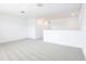 Bright loft space with neutral carpeting and recessed lighting, offering a versatile area at 2097 Rosewood Dr, Bartow, FL 33830