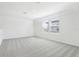 Bright bedroom showcasing neutral colors, plush carpet, and inviting natural light through windows at 2098 Rosewood Dr, Bartow, FL 33830