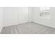 Bright bedroom with neutral walls and carpet, complete with a window and a closet at 2098 Rosewood Dr, Bartow, FL 33830