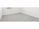 Inviting bedroom with neutral carpet, bright walls, and a window for natural light at 2098 Rosewood Dr, Bartow, FL 33830