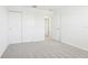 Comfortable bedroom with neutral carpet, bright walls, and a convenient closet at 2098 Rosewood Dr, Bartow, FL 33830