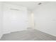 Bright bedroom features neutral colors, plush carpet, and a convenient closet at 2098 Rosewood Dr, Bartow, FL 33830