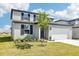 Well-maintained home with lush landscaping, a two-car garage, and charming curb appeal at 2098 Rosewood Dr, Bartow, FL 33830