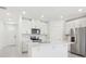 Modern kitchen features an island, stainless steel appliances, and white cabinets perfect for cooking at 2098 Rosewood Dr, Bartow, FL 33830
