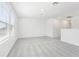 Spacious living room with large windows and neutral carpet provides ample natural light and comfort at 2098 Rosewood Dr, Bartow, FL 33830