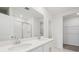 Modern bathroom with double sinks, quartz countertop and glass shower at 2105 Rosewood Dr, Bartow, FL 33830