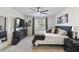 Serene bedroom features a plush bed, elegant decor, and ample natural light creating a tranquil and relaxing retreat at 211 Lazio Cir, Debary, FL 32713