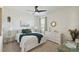 Bright bedroom with a comfortable bed, decorative lamps, and a dresser at 211 Lazio Cir, Debary, FL 32713