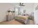 Stylishly furnished bedroom with a ceiling fan and a neutral color palette at 211 Lazio Cir, Debary, FL 32713