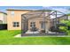A screened-in patio area perfect for outdoor dining and relaxation at 211 Lazio Cir, Debary, FL 32713