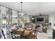 Dining area seamlessly connecting to living room, featuring stylish decor, natural light, and comfortable seating for entertaining at 211 Lazio Cir, Debary, FL 32713
