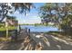 Community dock and lake access point with a 'No Wake' sign for residents to enjoy the water at 211 Lazio Cir, Debary, FL 32713
