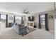 Inviting living room with large windows, plush seating, and modern decor at 211 Lazio Cir, Debary, FL 32713