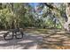 Community park featuring picnic tables and mature landscaping for residents to relax outdoors at 211 Lazio Cir, Debary, FL 32713
