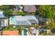 Aerial view showcases this home and backyard pool, surrounded by lush greenery at 250 Cortland Ave, Winter Park, FL 32789