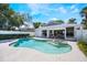 Refreshing private pool and spa area with clear blue water, lush landscaping, and access to the home at 250 Cortland Ave, Winter Park, FL 32789