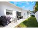 Backyard features a well-maintained lawn, patio seating, and fresh landscaping at 250 Cortland Ave, Winter Park, FL 32789