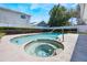 Inviting backyard spa with clear water, surrounded by lush greenery and a view of neighboring houses at 250 Cortland Ave, Winter Park, FL 32789